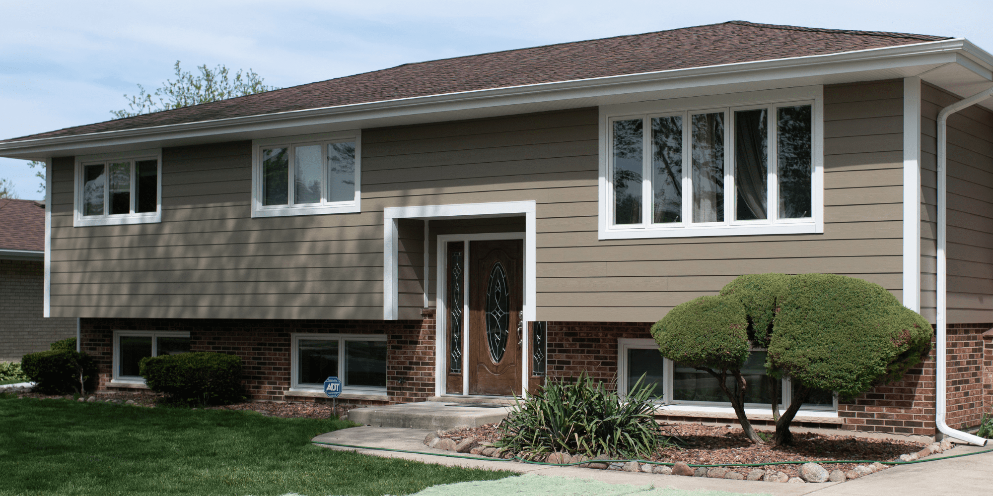 Exterior View of House with Replaced Windows