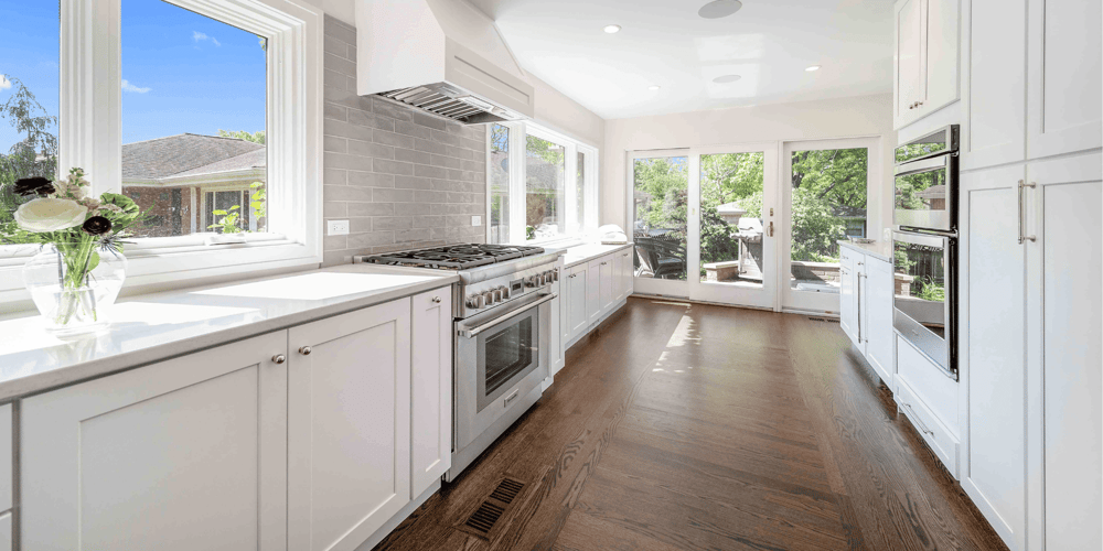 Bright Galley Kitchen with Built In Oven and Custom Range Hood in Chicago Suburbs