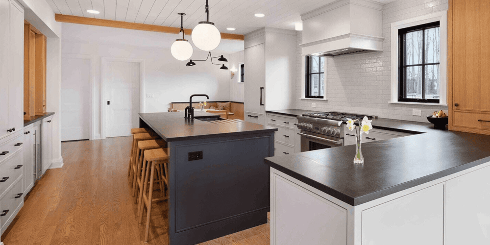 Kitchen Remodel in the Chicago Suburbs with Black Countertops and Natural Wood