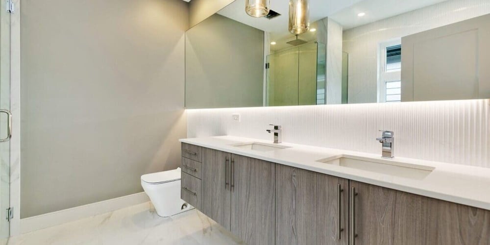 Luxury Upscale Bathroom Remodel in Chicago Suburbs with Large Mirror and Double Vanity