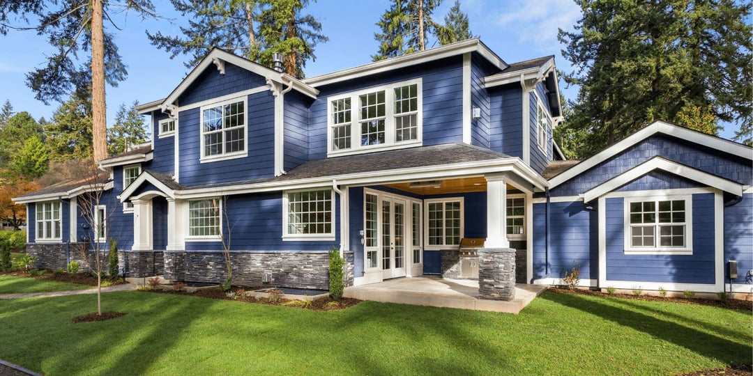 Stock Image of a Blue House with New White Windows