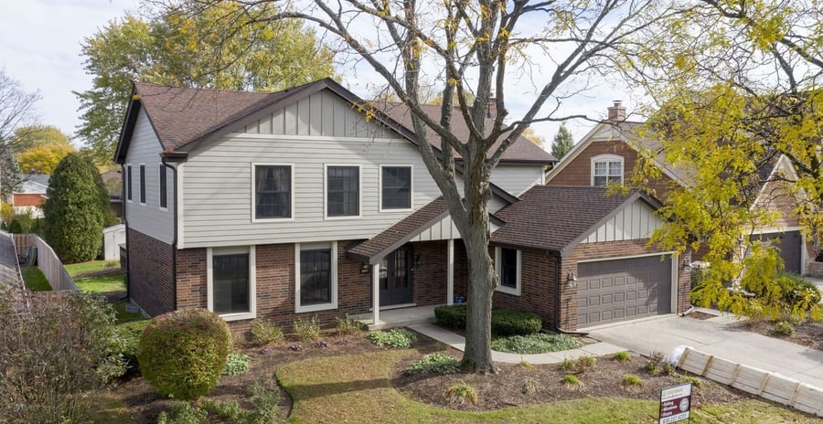 Naperville home with tan James Hardie siding and brick exterior