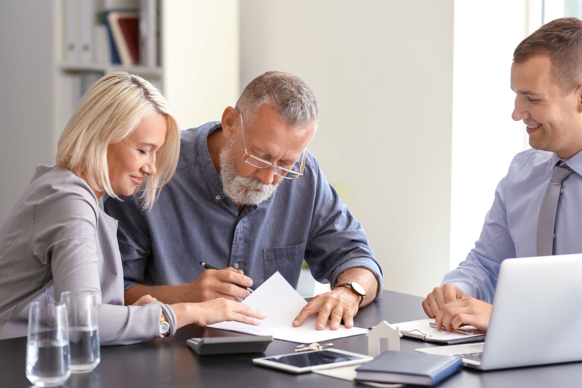 Financing Page Stock Photo of Couple Signing Papers