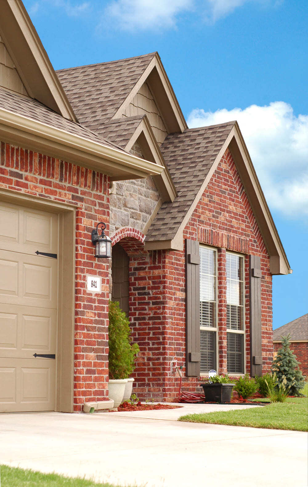 Stock Image of Brick Sided House with New Windows Vertical