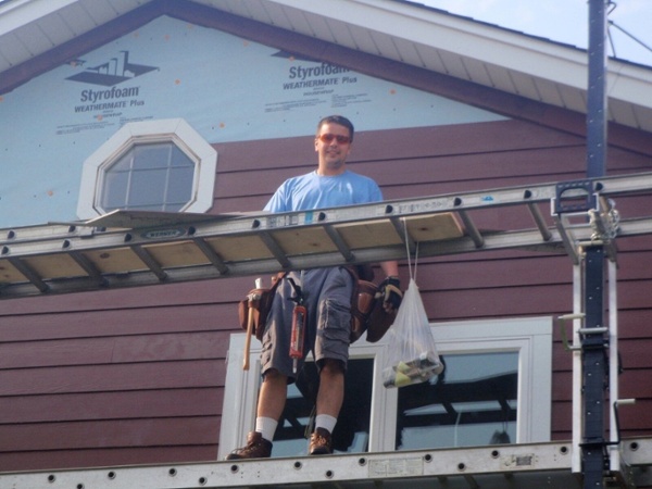 marek of smardbuild in 2000 working on exterior of chicago home-1-1