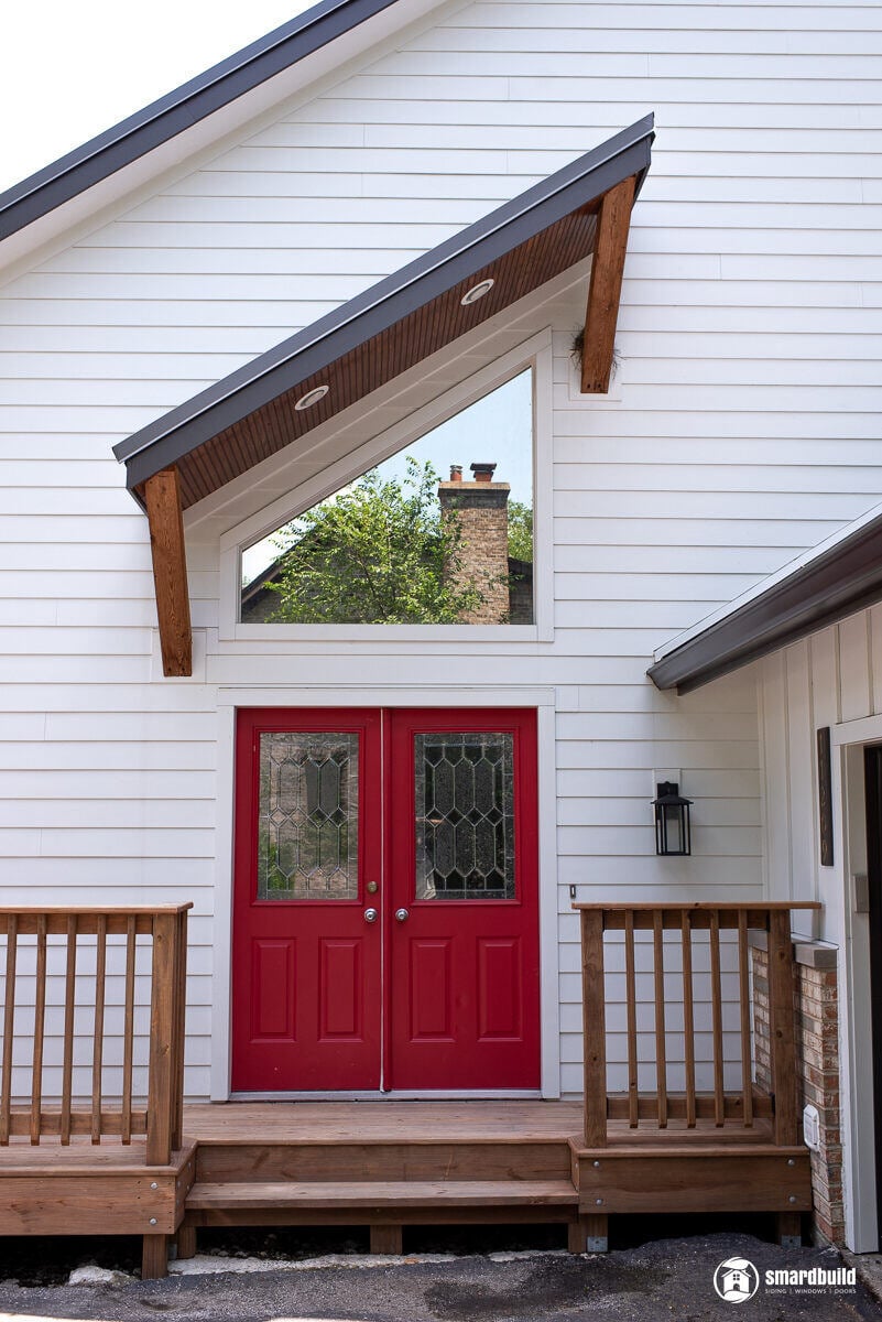 Front entrance with red double doors on a white house remodeled by Smardbuild in Naperville, Chicago (1)