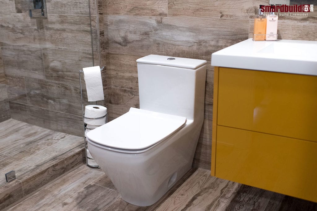 Modern bathroom with yellow vanity