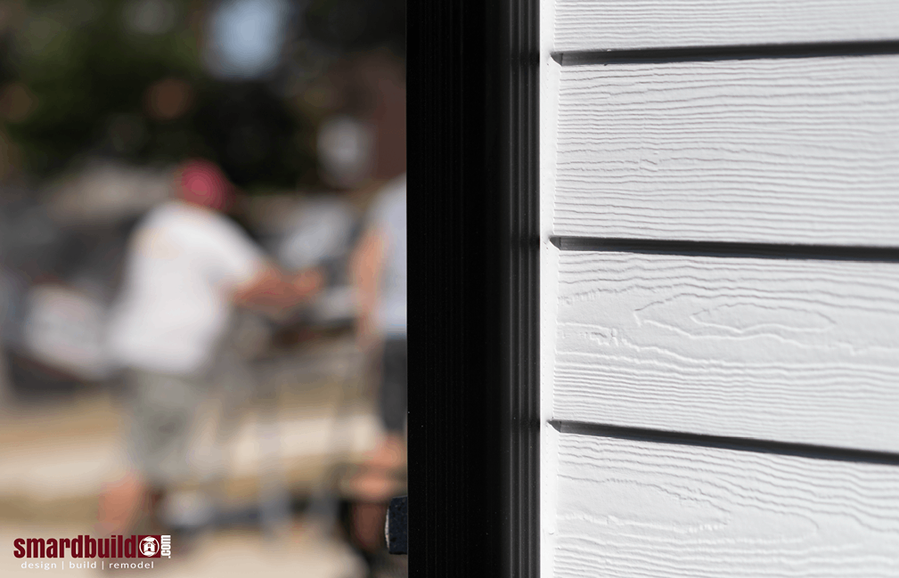 Light gray exterior home siding with black trim