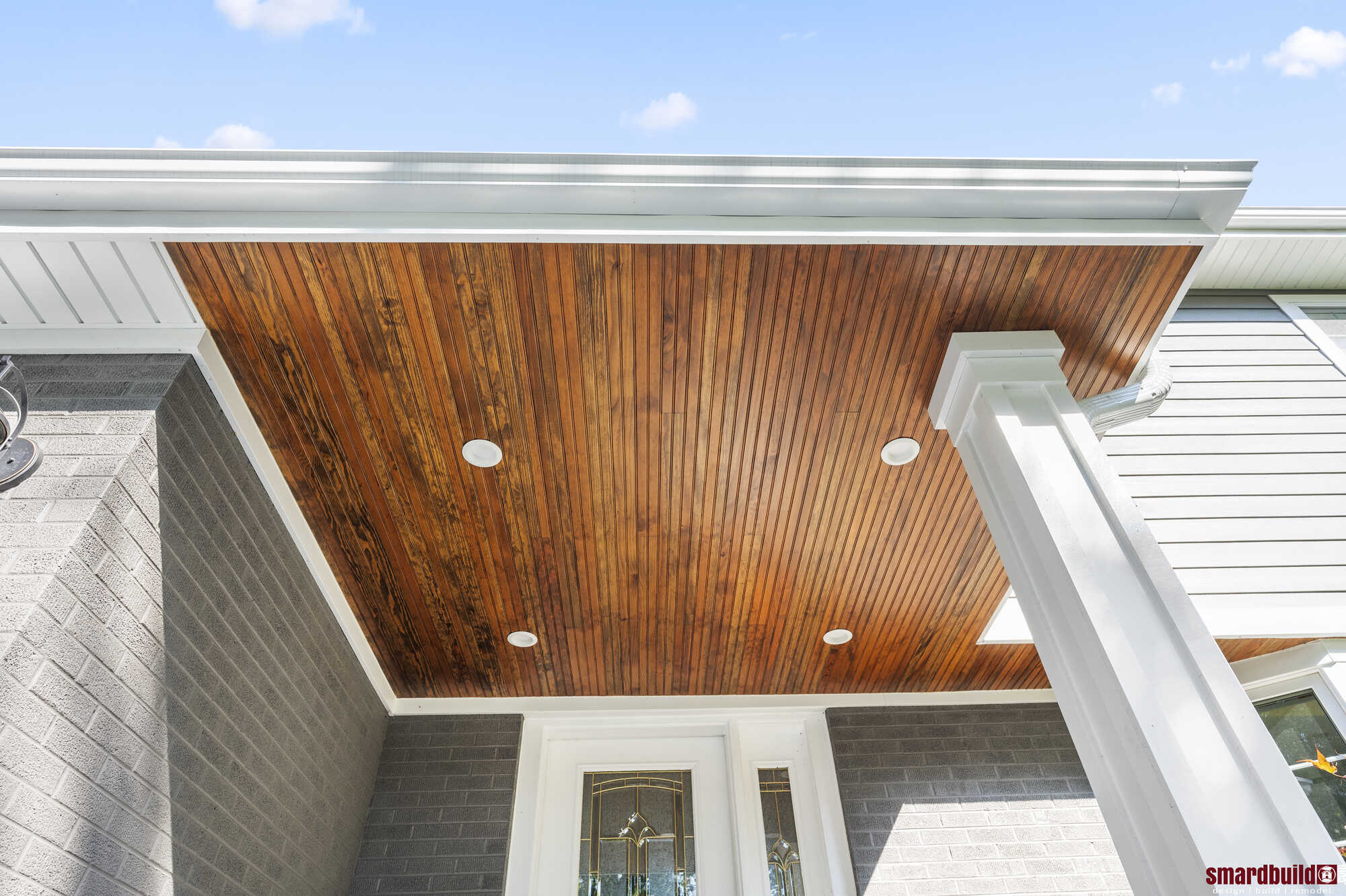 Renovated porch with a wood-paneled ceiling by Smardbuild in Naperville, IL